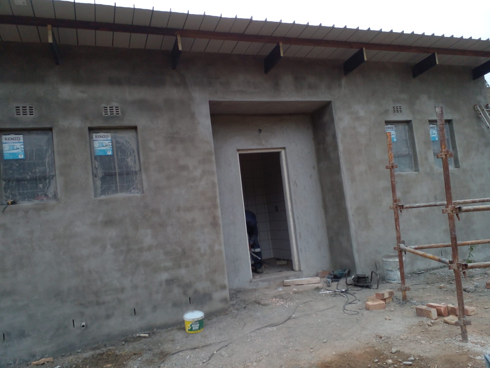 Plastered commercial building exterior nearing completion